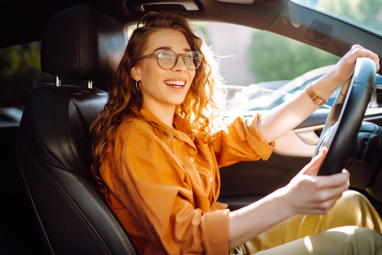 Happy customer in the front seat of a vehicle